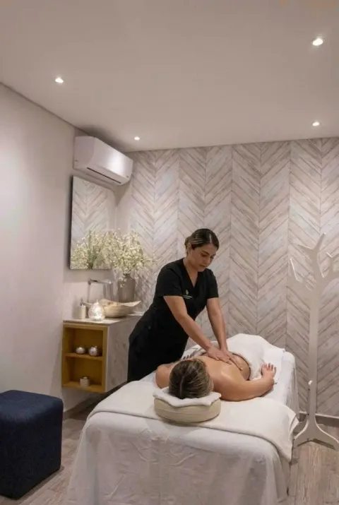 a woman getting a massage at a spa